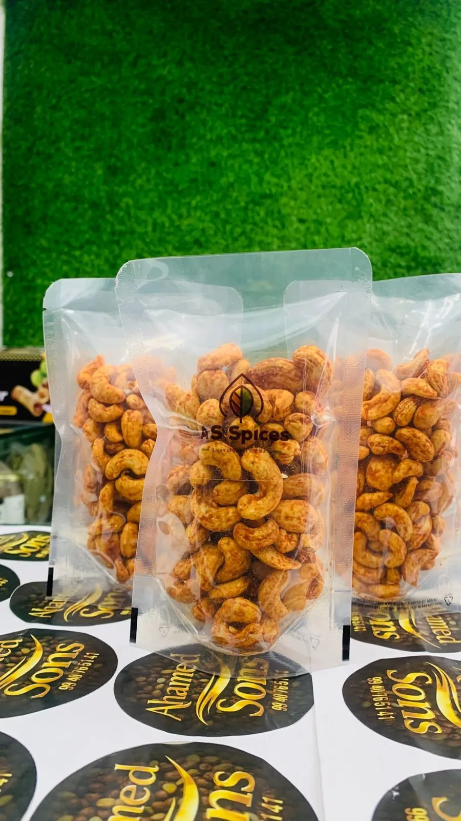 Pouches of spiced cashews with the A S Spices label