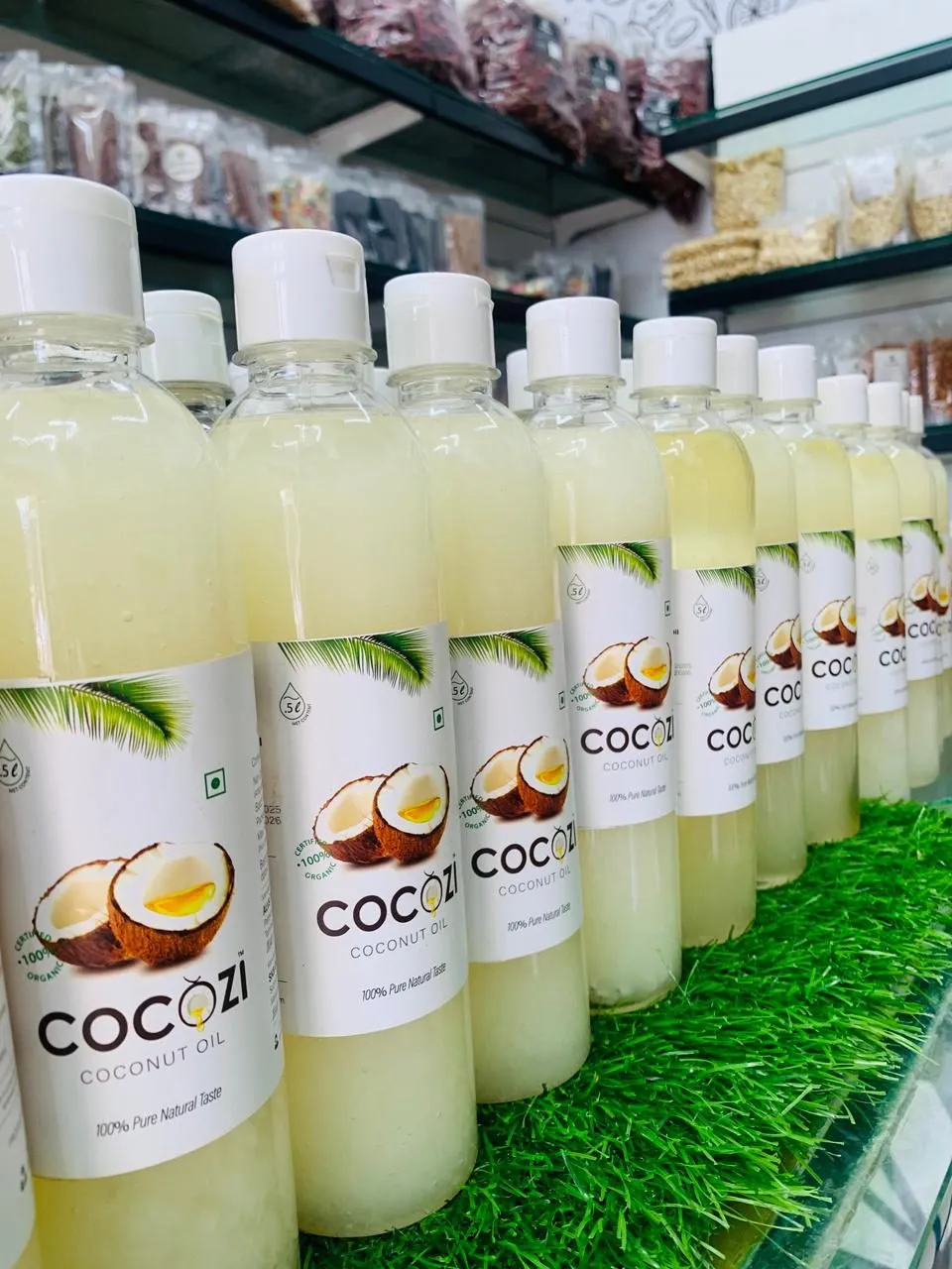 Cocozi coconut oil bottles on a shelf