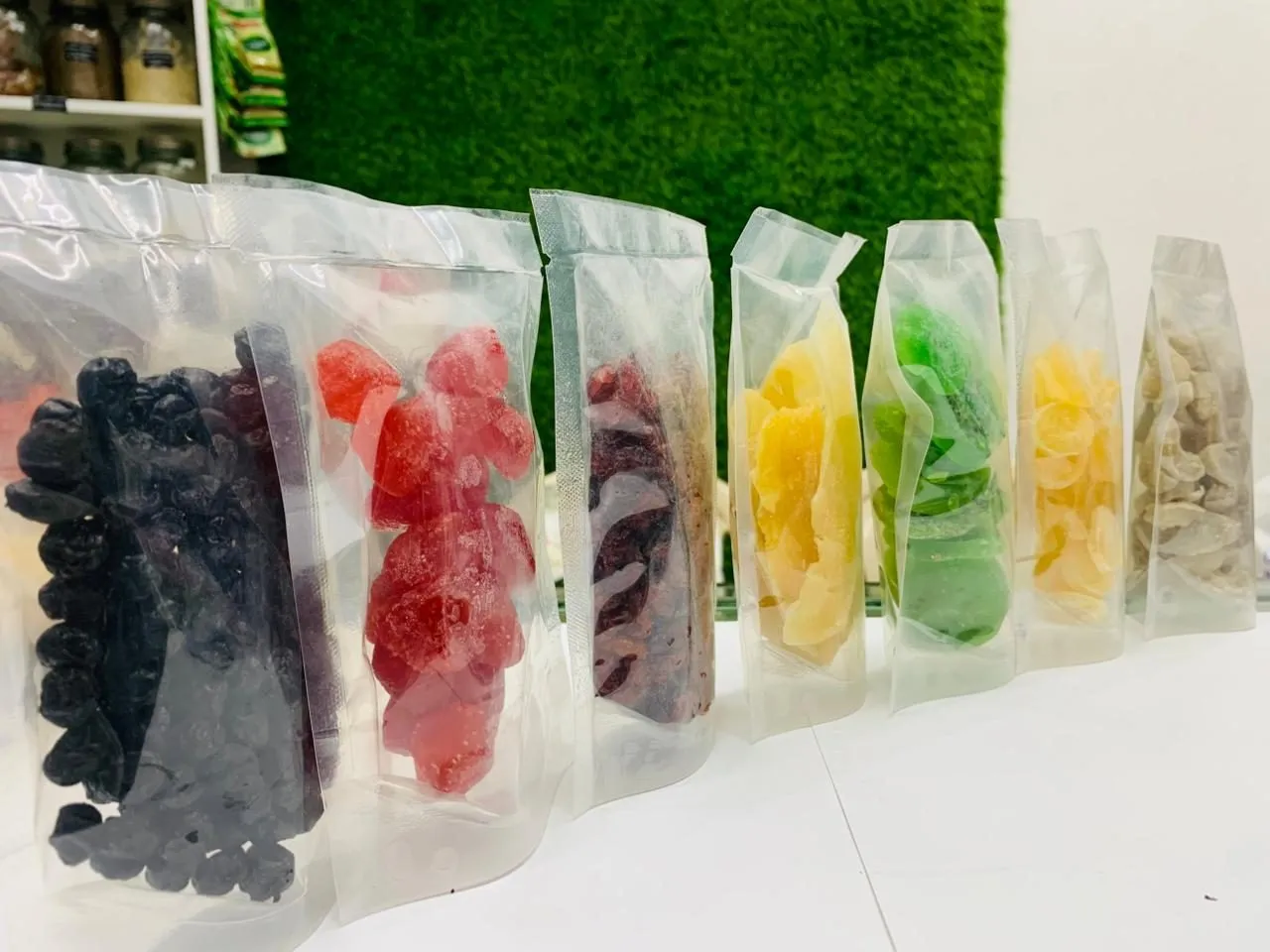 Clear pouches of dried fruit in many colours