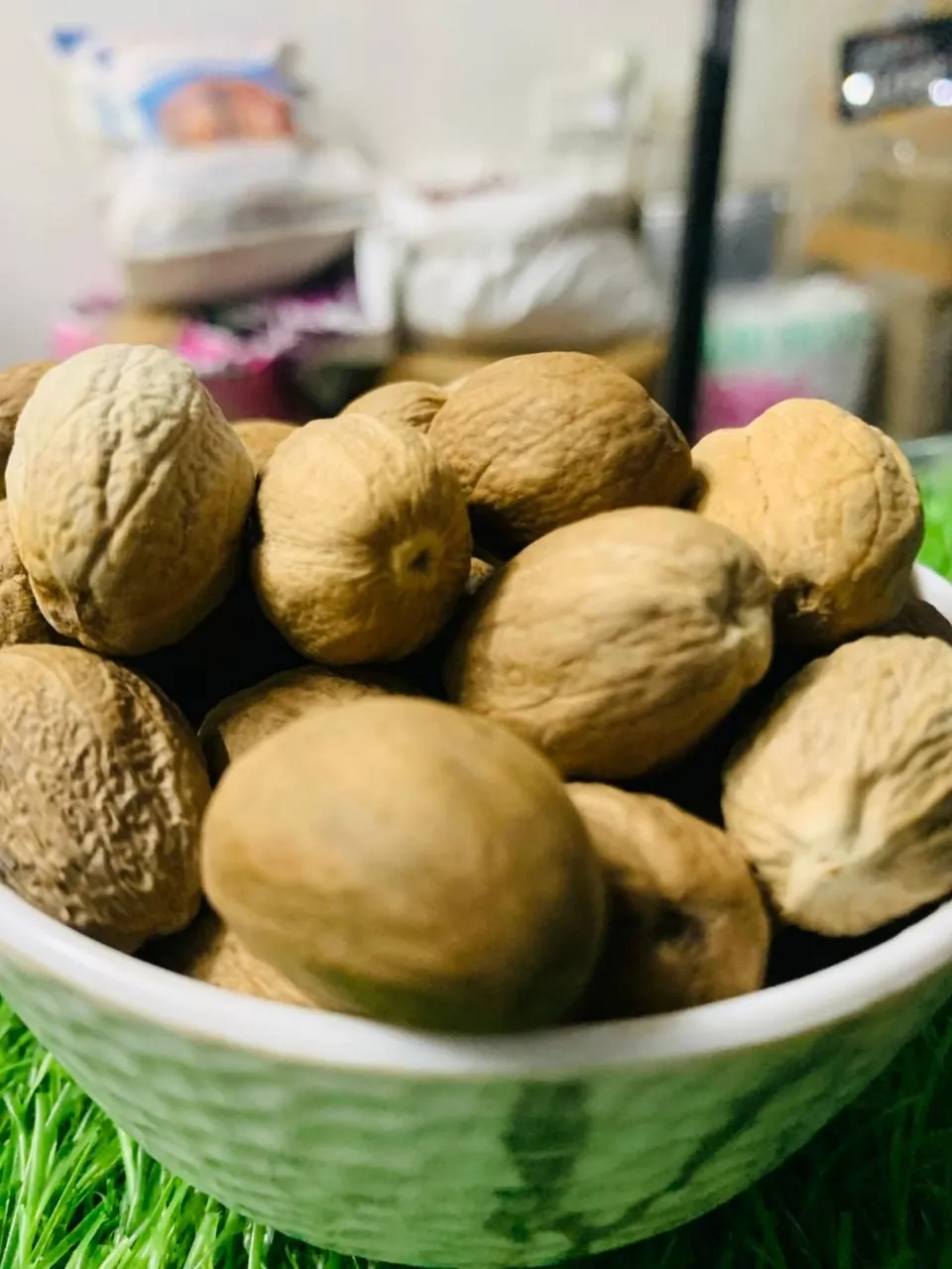 A bowl of whole nutmeg