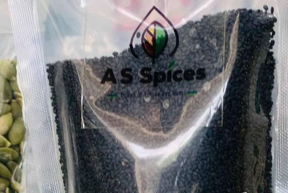A clear AS Spices pouch of black sabja seeds
