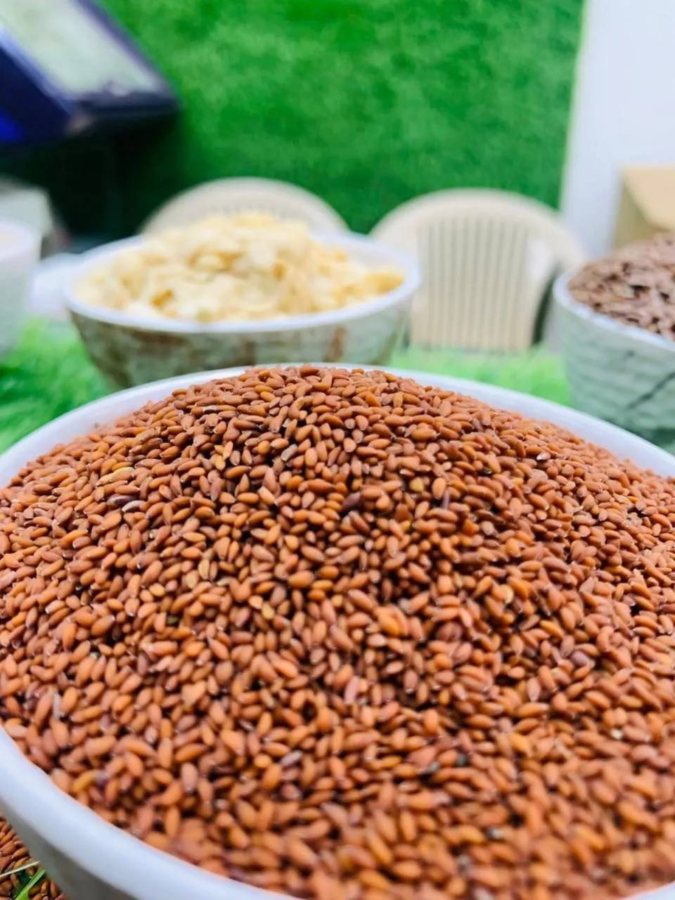 Red-brown seeds heaped in a bowl on the counter
